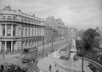 View of Union Terrace, Aberdeen, with a tram including statue of King Edward VII.