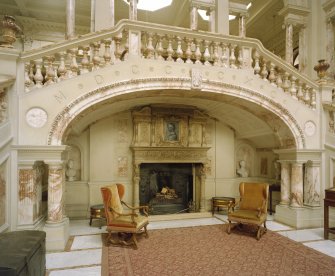 Gosford House. Detail of fireplace and staircase in marble hall.