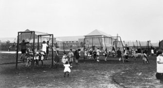 Scanned copy of a slide of the children's playground, Newtongrange. Lent for copying by the Gorebridge and District Local History Society.