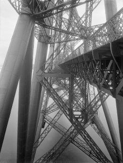 View of Forth Bridge, taken from the edge of the bridge at deck level showing the structure above and below.