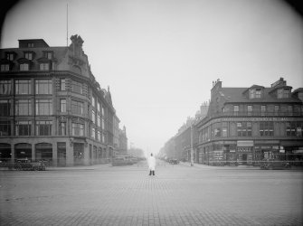 View from south of South Charlotte Street showing 134 and 136 Princes Street, cars and traffic warden.