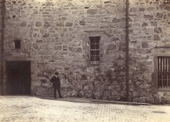Historic photograph.
View of ground level or 'vaults' of the Naval and Military Museum   Mount signed: 'Thomas Ross' and inscribed: 'Edinburgh Castle. December 1912'