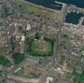 Oblique aerial view of Rothesay centred on the remains of the castle and chapel, taken from the S.