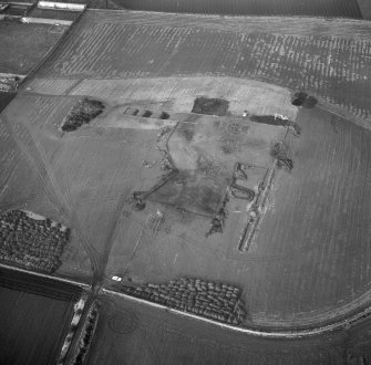 Oblique aerial view centred on the fort during excavation, taken from the SE.