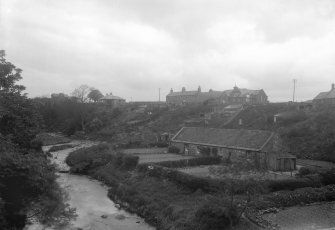 General view of village from East on bridge on Kirkgate.