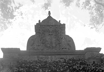 Detail of heraldic pediment over garden entrance.