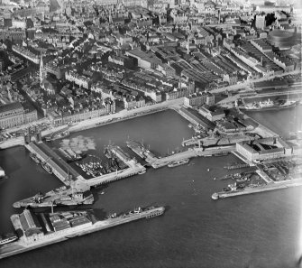 Dundee, general view, showing King William IV Dock and Tidal Harbour.  Oblique aerial photograph taken facing north. 