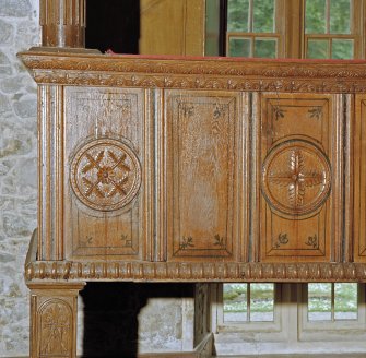 Interior.
Laird's loft, detail of carved panels at W end of balcony.