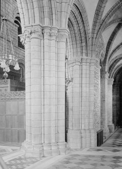 Interior. Choir, view of aisle and capital.