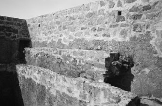 Interior.
Keep, detail of W parapet from N.