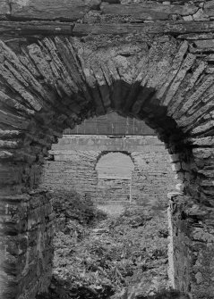 View of chancel arch and W doorway.