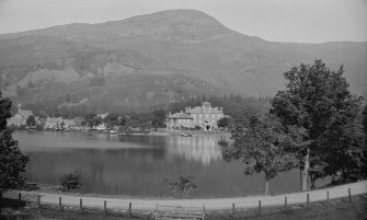 Distant view of St Fillans village and Drummond Arms Hotel, from across Loch Earn.
