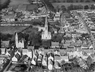 Cupar, general view, showing St John's Church of Scotland and Bonnygate United Presbyterian Church.  Oblique aerial photograph taken facing north.