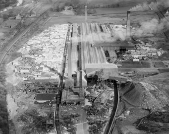 Oblique aerial view of John G Stein and Co. Ltd., Castlecary Brickworks taken facing east.
