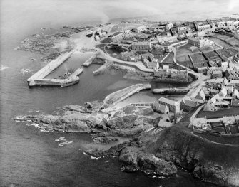 Portsoy, general view, showing Old and New Harbours.  Oblique aerial photograph taken facing east.