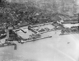 Dundee, general view, showing King William IV Dock and Tidal Harbour.  Oblique aerial photograph taken facing north. 