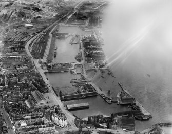 Dundee, general view, showing Camperdown, Victoria and King William IV Docks.  Oblique aerial photograph taken facing east.