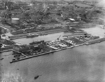 Dundee, general view, showing Victoria Dock and Queen Elizabeth Wharf.  Oblique aerial photograph taken facing north.