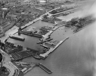 Dundee, general view, showing King William IV Dock and Tidal Harbour.  Oblique aerial photograph taken facing north. 