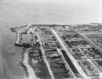 Lossiemouth, general view, showing Commerce Street, Lossiemouth Harbour and Marina Quay.  Oblique aerial photograph taken facing east.
