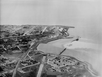 Lossiemouth, general view, showing Old Harbour and Spey Bay.  Oblique aerial photograph taken facing north.  