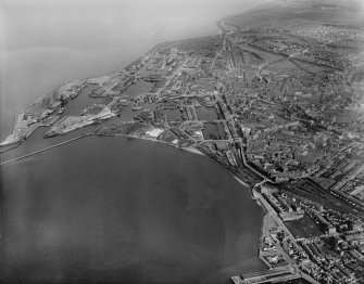 Edinburgh, general view, showing Leith Docks and Leith Links.  Oblique aerial photograph taken facing east.