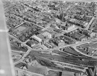 Kirkcaldy, general view, showing National Linoleum Works, Bennochy Road and St Brycedale Church of Scotland.  Oblique aerial photograph taken facing east.