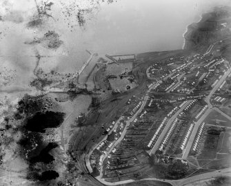 Leven, general view, showing Methil Docks and South Street.  Oblique aerial photograph taken facing south-west. This image has been produced from a damaged negative.