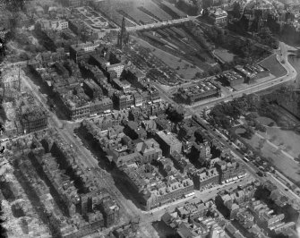 Edinburgh, general view, showing George Street, The Mound and Princes Street Gardens.  Oblique aerial photograph taken facing east.  This image has been produced from a damaged negative.
