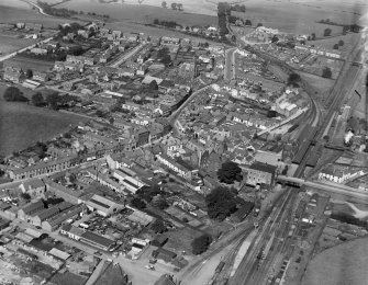 Lockerbie, general view, showing Market Cross and Townhead Street.  Oblique aerial photograph taken facing north.