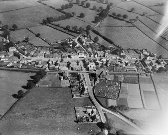 Ecclefechan, general view, showing Hoddam Road, High Street and Johnstone United Presbyterian Church.  Oblique aerial photograph taken facing north-east.