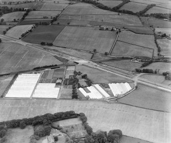 The A8 Glasgow and Edinburgh Road, Garrowhill, Glasgow.  Oblique aerial photograph taken facing north.