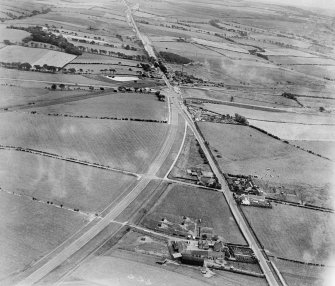 The A8 Glasgow and Edinburgh Road, Newhouse, Motherwell.  Oblique aerial photograph taken facing east.