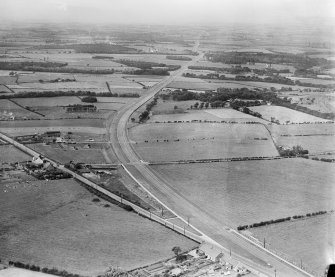 The A8 Glasgow and Edinburgh Road, Newhouse, Motherwell.  Oblique aerial photograph taken facing west.