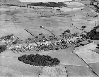 Kirkcowan, general view, showing Main Street and Knockbreck.  Oblique aerial photograph taken facing east.