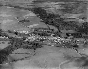 Creetown, general view, showing St John Street and Hill of Burns.  Oblique aerial photograph taken facing east.