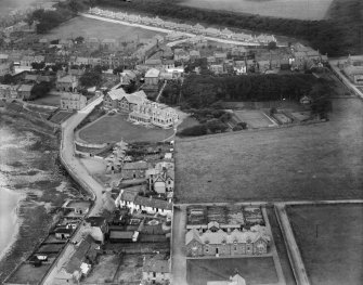 Elie, general view, showing The Toft and Woodside Road.  Oblique aerial photograph taken facing north.