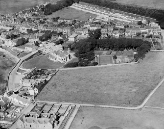 Elie, general view, showing The Toft and Woodside Road.  Oblique aerial photograph taken facing north.