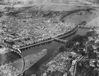 Perth, general view, showing the Bridges and North Inch Golf Course.  Oblique aerial photograph taken facing north.