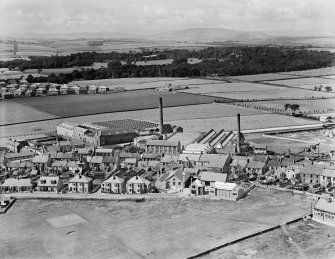 Kirkcaldy, general view, showing Hawkleymuir Linen Factory and Sinclairtown Pottery.  Oblique aerial photograph taken facing west.