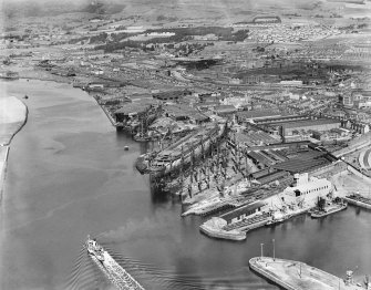 Clydebank, general view, showing Forth and Clyde Canal and John Brown's Shipyard, Queen Mary under construction.  Oblique aerial photograph taken facing north.