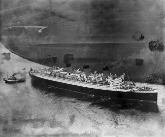 Queen Mary, River Clyde, Clydebank.  Oblique aerial photograph taken facing south.  This image has been produced from a damaged negative.