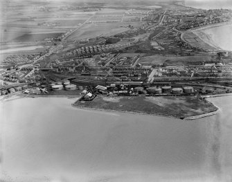 Ardrossan, general view, showing Ardrossan Refinery and South Crescent Road.  Oblique aerial photograph taken facing east.