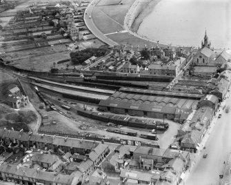Ardrossan Town Station and Barony Church of Scotland, Arran Place, Ardrossan.  Oblique aerial photograph taken facing east.
