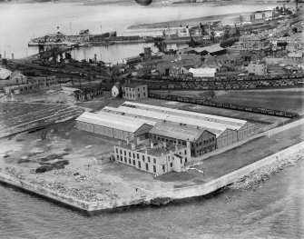 Former Ardrossan Dry Dock and Shipbuilding Co. Inches Yard and Inner Harbour, Ardrossan.  Oblique aerial photograph taken facing north.