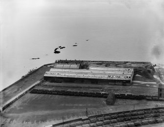 Former Ardrossan Dry Dock and Shipbuilding Co. Inches Yard, Ardrossan.  Oblique aerial photograph taken facing south.