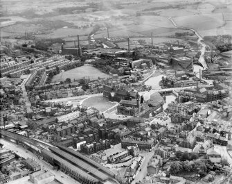 Paisley, general view, showing Paisley Abbey and Clark and Co. Anchor Mills Thread Works.  Oblique aerial photograph taken facing south-east.