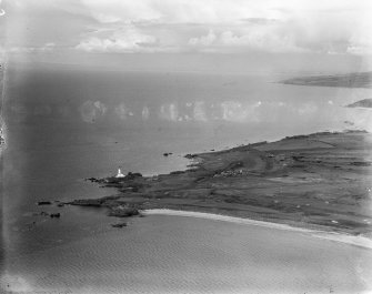 Turnberry Lighthouse and Turnberry Bay.  Oblique aerial photograph taken facing north.  This image has been produced from a damaged negative.