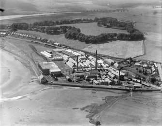 William Haig and Sons Guardbridge Paper Co. Paper Mill, Main Street, Guardbridge.  Oblique aerial photograph taken facing south-west.