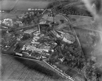 Tullis Russell and Co. Paper Mill, Glenrothes.  Oblique aerial photograph taken facing north.  This image has been produced from a damaged negative.